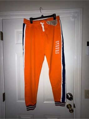 Men’s Strivers Row Stripe Jogger Pants with cuff detail. Sz L